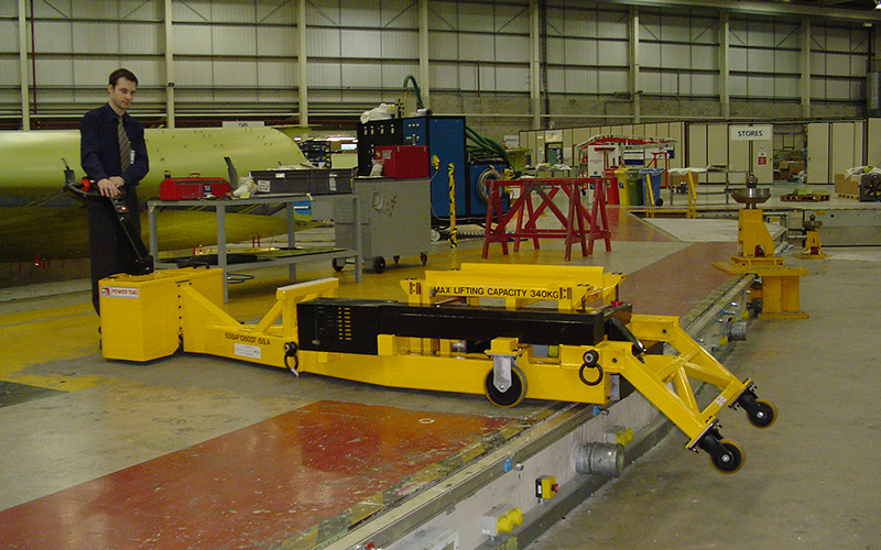 Custom PowerTug for positioning lifting brackets onto Airbus wing sections Custom PowerTug for positioning lifting brackets onto Airbus wing sections