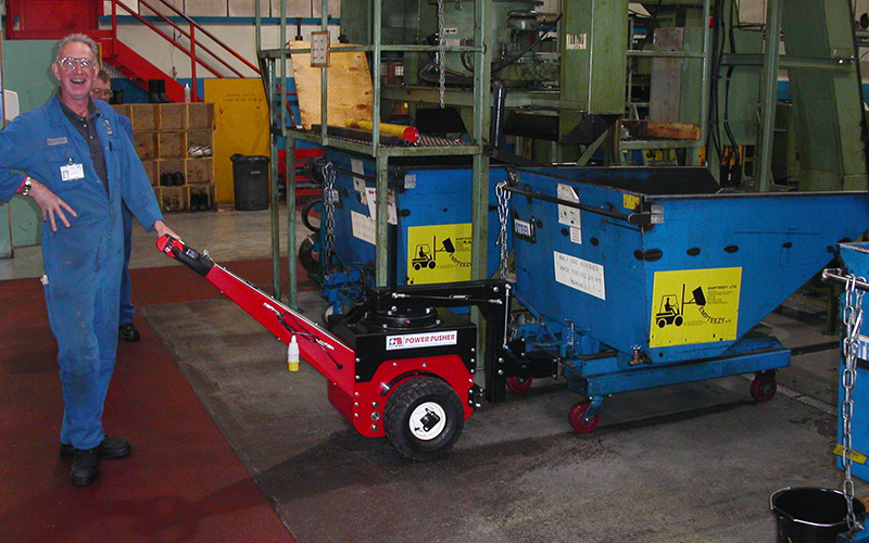 Power Pusher, with Steering Arm, moving Empteezy tipping skip in machine shop Power Pusher, with Steering Arm, moving Empteezy tipping skip in machine shop