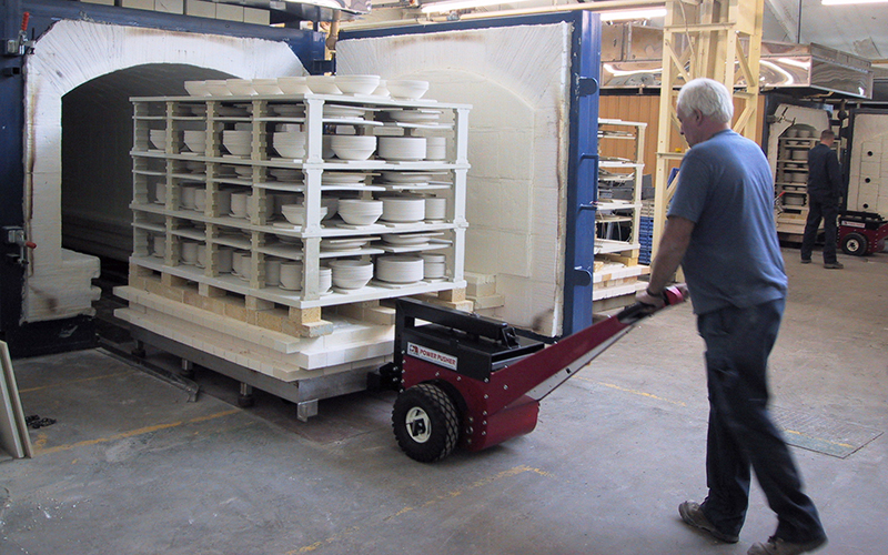Power Pusher, with Steering Arm, moving kiln trolley into and out of Autoclave at Churchill China plc Power Pusher, with Steering Arm, moving kiln trolley into and out of Autoclave at Churchill China plc