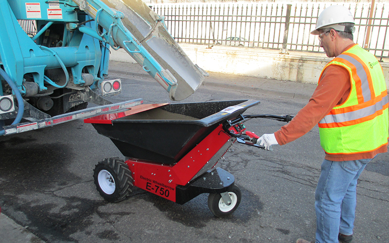 Using the MUV - Electric Wheelbarrow to transport concrete from roadside delivery lorry Using the MUV - Electric Wheelbarrow to transport concrete from roadside delivery lorry